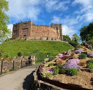 Image shows the approach to Tamworth Castle, on a sunny day